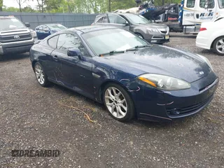 2008 Hyundai Tiburon GT z VIN KMHHN66F98U281833, wystawiony jako IAAI lot #42242717 z przebiegiem 123 291 mil mil oraz . Historia ofert i sprzedaży dostępna na DreamBid. Obrazek 1.