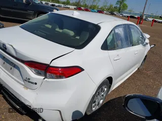 2023 Toyota Corolla Hybrid LE with VIN JTDBCMFE7P3008888, listed as a IAAI auction lot 41943160 with 168,198 mi miles. Bid and sale history available at carsss.com. Image 4.