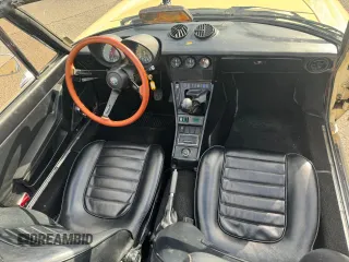 1985 Alfa Romeo Spider Veloce z VIN ZARBA5415F1020937, wystawiony jako Copart lot #63728494 z przebiegiem 115 547 mil mil oraz Tytuł czysty. Historia ofert i sprzedaży dostępna na DreamBid. Obrazek 9.