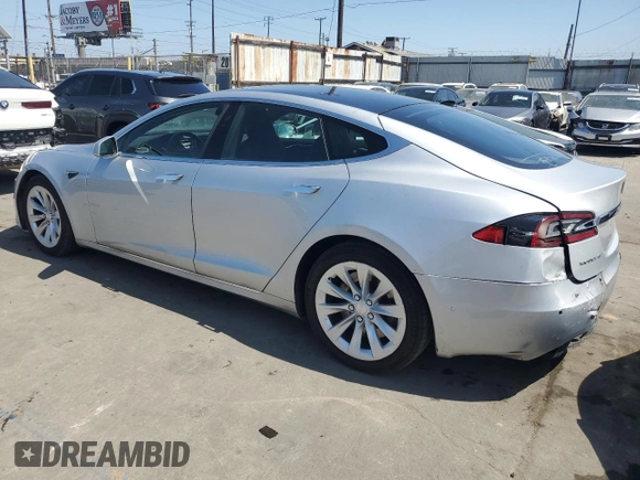 2017 Tesla Model S 60 with VIN 5YJSA1E17HF189627, listed as a Copart auction lot 64454635 with 106,003 mi miles and Salvage title. Bid and sale history available at DreamBid. Image 2.