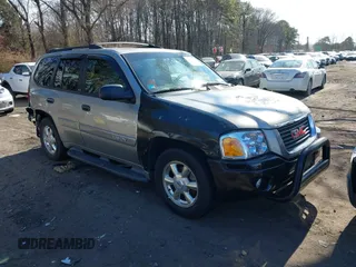 2002 GMC Envoy SLT with VIN 1GKDT13S922356423, listed as a IAAI auction lot 41615971 with 157,280 mi miles. Bid and sale history available at carsss.com. Image 1.