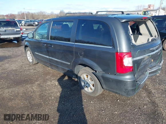 2012 Chrysler Town & Country Touring with VIN 2C4RC1BG8CR213738, listed as a IAAI auction lot 41912682 with 211,470 mi miles and . Bid and sale history available at DreamBid. Image 3.