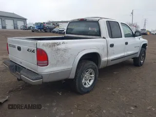 2002 Dodge Dakota SLT z VIN 1B7HG48N72S577296, wystawiony jako IAAI lot #41848637 z przebiegiem 133 777 mil mil oraz . Historia ofert i sprzedaży dostępna na DreamBid. Obrazek 4.