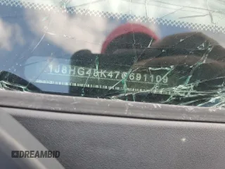 2007 Jeep Commander Sport z VIN 1J8HG48K47C691109, wystawiony jako Copart lot #52138775 z przebiegiem 231 327 mil mil oraz Szkoda całkowita • Salvage title. Historia ofert i sprzedaży dostępna na DreamBid. Obrazek 12.