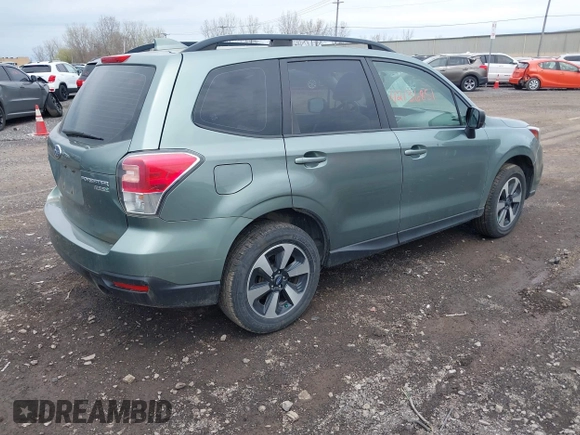 2017 Subaru Forester with VIN JF2SJABC3HH442661, listed as a IAAI auction lot 42136851 with 89,791 mi miles and . Bid and sale history available at DreamBid. Image 4.