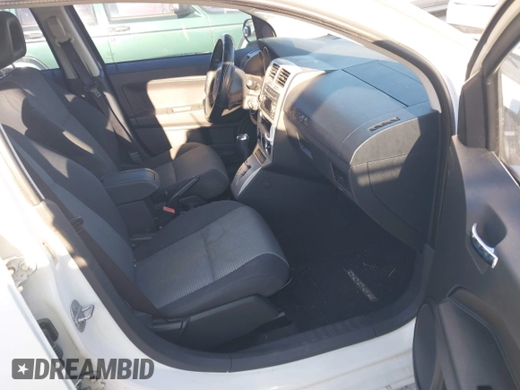 2009 Dodge Caliber SXT with VIN 1B3HB48A39D233105, listed as a IAAI auction lot 41872576 with Not Provided miles and . Bid and sale history available at DreamBid. Image 5.