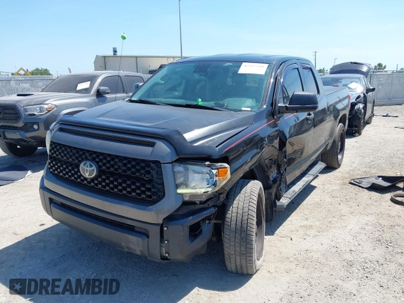 2019 Toyota Tundra SR with VIN 5TFUY5F13KX852912, listed as a IAAI auction lot 42327399 with 124,193 mi miles and . Bid and sale history available at DreamBid. Image 6.
