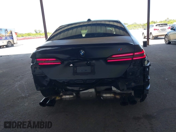 2025 BMW 5 Series with VIN WBS83FK04SCU11874, listed as a IAAI auction lot 42543784 with 4,517 mi miles and . Bid and sale history available at DreamBid. Image 16.