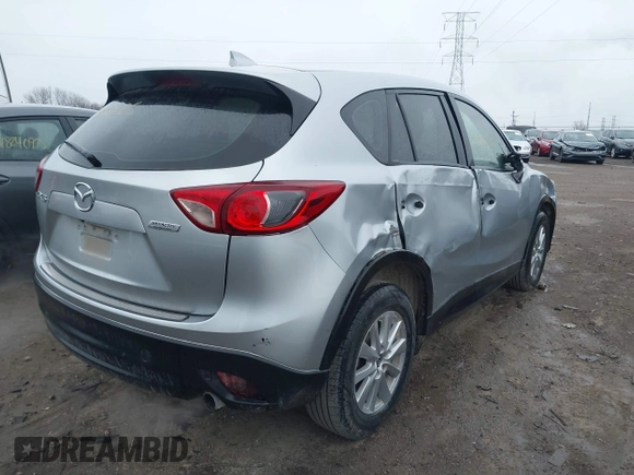 2016 Mazda CX-5 Sport with VIN JM3KE2BY5G0647715, listed as a IAAI auction lot 41831228 with 89,689 mi miles and . Bid and sale history available at DreamBid. Image 4.