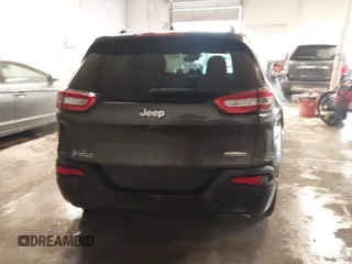 2016 Jeep Cherokee Altitude z VIN 1C4PJLCB0GW338970, wystawiony jako IAAI lot #41559196 z przebiegiem 129 366 mil mil oraz . Historia ofert i sprzedaży dostępna na DreamBid. Obrazek 16.