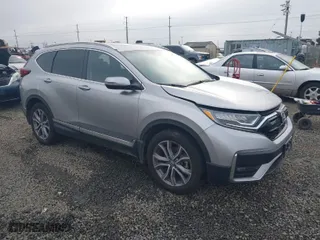 2021 Honda CR-V Touring with VIN 2HKRW2H9XMH212692, listed as a IAAI auction lot 41016640 with 24,149 mi miles. Bid and sale history available at carsss.com. Image 1.