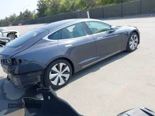 2020 Tesla Model S Long Range with VIN 5YJSA1E24LF415849, listed as a IAAI auction lot 42571945 with 34,398 mi miles and . Bid and sale history available at DreamBid. Image 4.