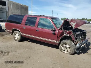 1998 GMC Suburban z VIN 3GKFK16R1WG503206, wystawiony jako Copart lot #69802344 z przebiegiem 231 148 mil mil oraz Szkody całkowita. Historia ofert i sprzedaży dostępna na DreamBid. Obrazek 4.