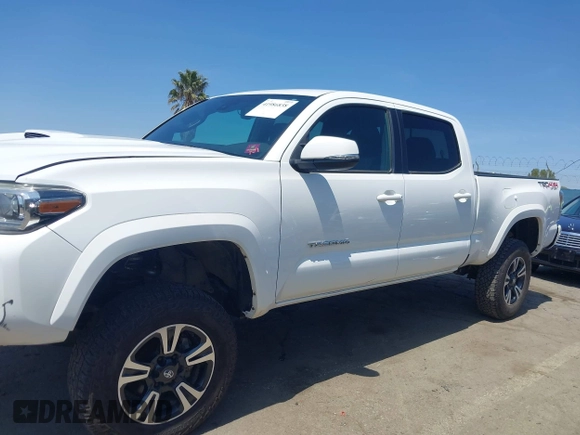 2021 Toyota Tacoma 4WD SR5 with VIN 3TMDZ5BN4MM106693, listed as a IAAI auction lot 41986838 with 52,510 mi miles. Bid and sale history available at carsss.com. Image 14.