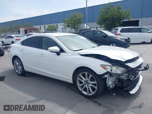 2016 Mazda Mazda6 i Touring with VIN JM1GJ1V57G1429887, listed as a IAAI auction lot 42029170 with 140,519 mi miles. Bid and sale history available at carsss.com. Image 1.