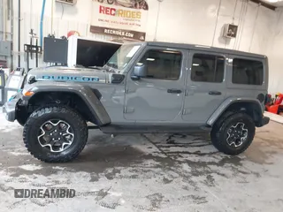 2021 Jeep Wrangler Unlimited Rubicon z VIN 1C4JJXR65MW675010, wystawiony jako IAAI lot #41990021 z przebiegiem 73 406 mil mil oraz . Historia ofert i sprzedaży dostępna na DreamBid. Obrazek 14.