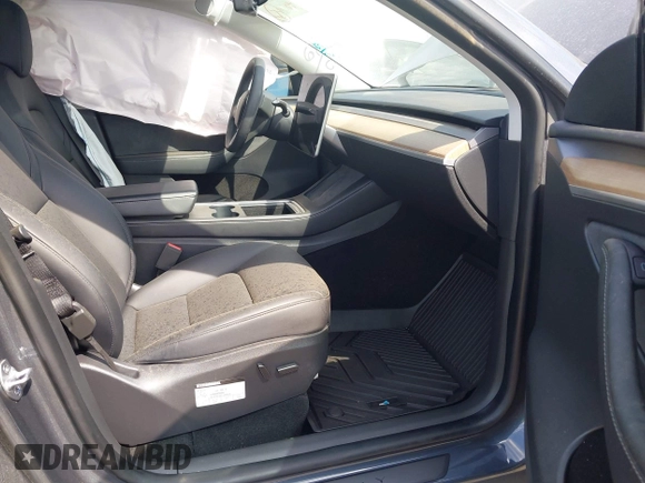 2022 Tesla Model Y Long Range with VIN 7SAYGDEE2NA017434, listed as a IAAI auction lot 41842025 with 35,164 mi miles and . Bid and sale history available at DreamBid. Image 5.