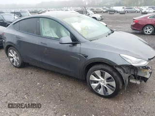 2021 Tesla Model Y Long Range z VIN 5YJYGAEE1MF145161, wystawiony jako IAAI lot #42156421 z przebiegiem 35 127 mil mil oraz . Historia ofert i sprzedaży dostępna na DreamBid. Obrazek 1.