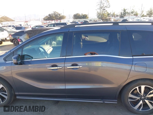 2018 Honda Odyssey Elite with VIN 5FNRL6H91JB052289, listed as a IAAI auction lot 41336068 with 94,685 mi miles and . Bid and sale history available at DreamBid. Image 13.