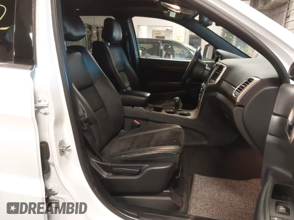 2015 Jeep Grand Cherokee Laredo with VIN 1C4RJFAG4FC660665, listed as a IAAI auction lot 41529532 with 124,099 mi miles. Bid and sale history available at carsss.com. Image 5.