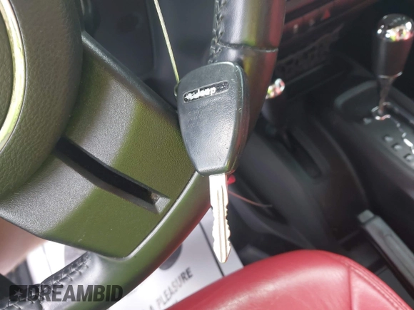2013 Jeep Wrangler Unlimited Sport with VIN 1C4BJWDG4DL599151, listed as a IAAI auction lot 42212831 with 143,865 mi miles and . Bid and sale history available at DreamBid. Image 11.