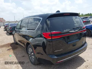 2023 Chrysler Pacifica Hybrid Touring L with VIN 2C4RC1L70PR622000, listed as a IAAI auction lot 42711826 with 65,109 mi miles and . Bid and sale history available at DreamBid. Image 3.