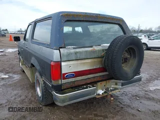 1987 Ford Bronco XL with VIN 1FMEU15N4HLA38776, listed as a IAAI auction lot 41767617 with 52,914 mi miles. Bid and sale history available at carsss.com. Image 3.