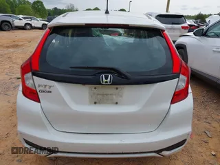 2019 Honda Fit LX z VIN 3HGGK5H4XKM704303, wystawiony jako IAAI lot #42019753 z przebiegiem 137 271 mil mil oraz . Historia ofert i sprzedaży dostępna na DreamBid. Obrazek 16.