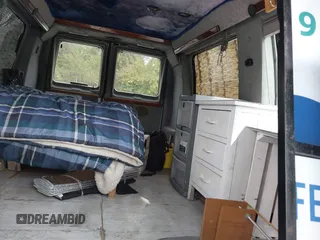 1999 Ford Econoline Cargo with VIN 1FDRE14WXXHB72976, listed as a IAAI auction lot 37688871 with 135,319 mi miles. Bid and sale history available at carsss.com. Image 8.