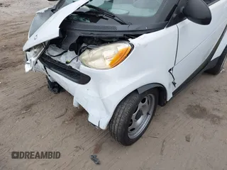 2009 Smart fortwo Pure z VIN WMEEJ31X39K314325, wystawiony jako IAAI lot #41607981 z przebiegiem 59 684 mil mil oraz . Historia ofert i sprzedaży dostępna na DreamBid. Obrazek 6.