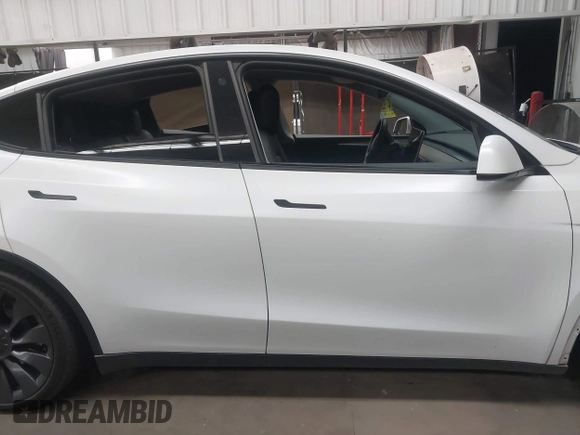 2023 Tesla Model Y Performance with VIN 7SAYGDEF5PF665560, listed as a IAAI auction lot 41809349 with Not Provided miles and . Bid and sale history available at DreamBid. Image 14.