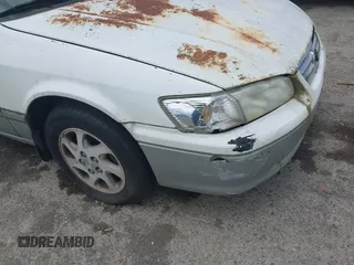 2001 Toyota Camry LE z VIN JT2BF22K310304712, wystawiony jako IAAI lot #42386743 z przebiegiem 103 552 mil mil oraz . Historia ofert i sprzedaży dostępna na DreamBid. Obrazek 6.