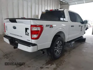 2023 Ford F-150 XL with VIN 1FTEW1EP7PKE20482, listed as a IAAI auction lot 41848669 with 27,933 mi miles. Bid and sale history available at carsss.com. Image 4.