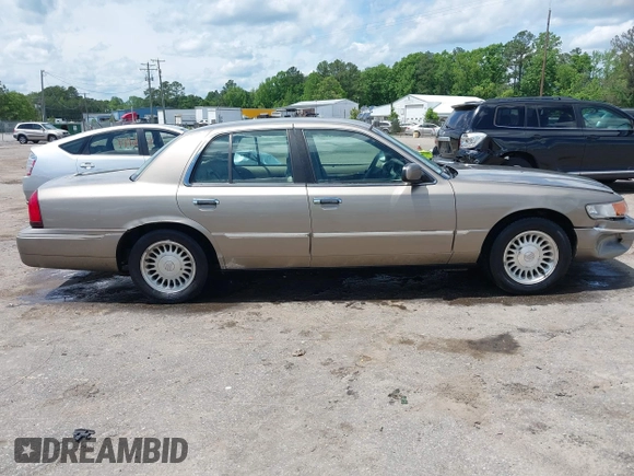 2001 Mercury Grand Marquis LS z VIN 2MEFM75W31X704182, wystawiony jako IAAI lot #42086175 z przebiegiem 177 892 mil mil oraz . Historia ofert i sprzedaży dostępna na DreamBid. Obrazek 13.
