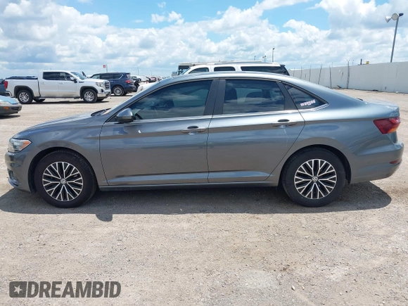2019 Volkswagen Jetta S z VIN 3VWC57BUXKM061537, wystawiony jako IAAI lot #42170921 z przebiegiem 88 476 mil mil oraz . Historia ofert i sprzedaży dostępna na DreamBid. Obrazek 14.
