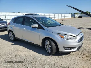 2017 Ford Focus Titanium with VIN 1FADP3N21HL279810, listed as a Copart auction lot 57950195 with 121,139 mi miles and Salvage title. Bid and sale history available at DreamBid. Image 4.