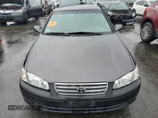 2000 Toyota Camry CE z VIN JT2BG22K7Y0479410, wystawiony jako Copart lot #57871825 z przebiegiem 222 941 mil mil oraz Tytuł czysty. Historia ofert i sprzedaży dostępna na DreamBid. Obrazek 5.