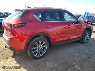 2021 Mazda CX-5 Signature with VIN JM3KFBEYXM0434778, listed as a Copart auction lot 51980255 with 34,283 mi miles and Salvage Title. Bid and sale history available at carsss.com. Image 3.