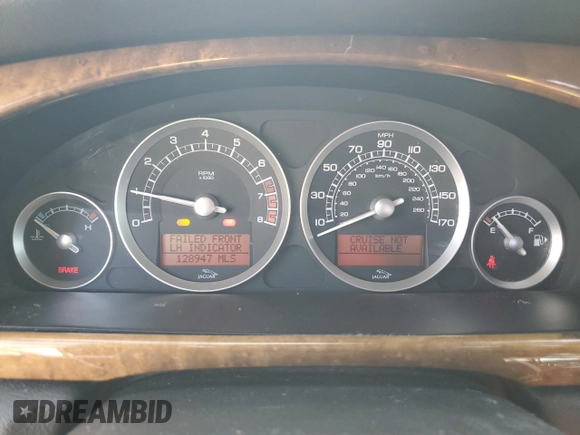 2005 Jaguar S-Type with VIN SAJWA03V251N28012, listed as a Copart auction lot 74417644 with 128,947 mi miles and Salvage Title. Bid and sale history available at DreamBid. Image 9.