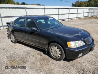 2004 Acura RL w/Navigation System with VIN JH4KA96624C004656, listed as a Copart auction lot 77021014 with 158,857 mi miles and Salvage Title. Bid and sale history available at carsss.com. Image 4.