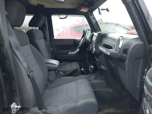 2011 Jeep Wrangler Unlimited Sahara with VIN 1J4BA5H12BL548870, listed as a IAAI auction lot 42010303 with 139,693 mi miles. Bid and sale history available at carsss.com. Image 5.