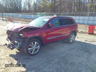 2013 Jeep Grand Cherokee Laredo with VIN 1C4RJEAG3DC631987, listed as a IAAI auction lot 41240182 with 186,193 mi miles. Bid and sale history available at carsss.com. Image 2.
