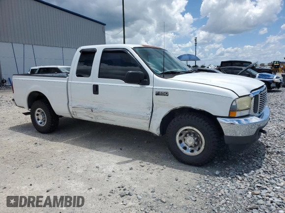 2003 Ford F-250 XL with VIN 1FTNX20L63EB37975, listed as a Copart auction lot 65723935 with 157,377 mi miles and Salvage title. Bid and sale history available at DreamBid. Image 4.