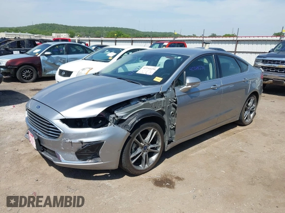 2020 Ford Fusion SEL with VIN 3FA6P0CDXLR196124, listed as a IAAI auction lot 42244231 with 99,306 mi miles and . Bid and sale history available at DreamBid. Image 2.