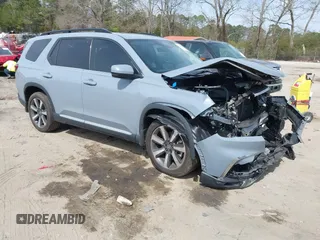 2023 Honda Pilot Touring z VIN 5FNYG2H73PB000968, wystawiony jako IAAI lot #41811452 z przebiegiem Nie podano mil oraz . Historia ofert i sprzedaży dostępna na DreamBid. Obrazek 1.