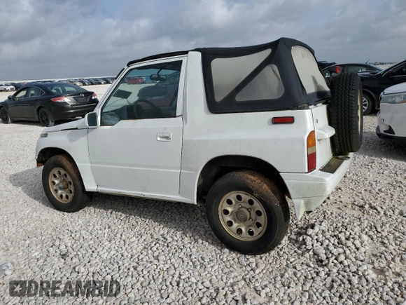 1994 Suzuki Sidekick z VIN 2S3TA01C8R6408593, wystawiony jako Copart lot #65011514 z przebiegiem 248 814 mil mil oraz Tytuł czysty. Historia ofert i sprzedaży dostępna na DreamBid. Obrazek 2.