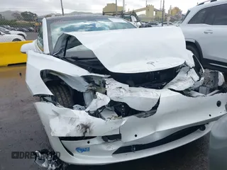 2020 Tesla Model 3 Standard Range Plus with VIN 5YJ3E1EA0LF741311, listed as a IAAI auction lot 41581931 with 43,284 mi miles. Bid and sale history available at carsss.com. Image 12.