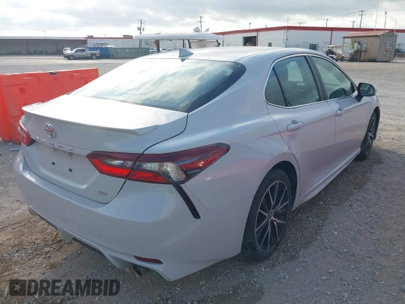2023 Toyota Camry SE with VIN 4T1G11AK7PU090957, listed as a IAAI auction lot 42022132 with 62,556 mi miles. Bid and sale history available at carsss.com. Image 4.