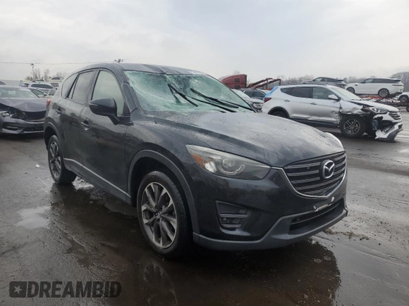 2016 Mazda CX-5 Grand Touring with VIN JM3KE4DYXG0711367, listed as a Copart auction lot 52862405 with 87,870 mi miles and Salvage Title. Bid and sale history available at DreamBid. Image 4.