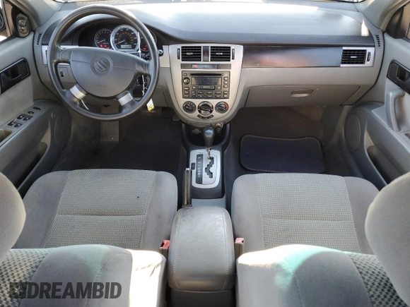 2006 Suzuki Forenza z VIN KL5JD56ZX6K278029, wystawiony jako Copart lot #82026904 z przebiegiem 117 700 mil mil oraz Szkoda całkowita • Salvage title. Historia ofert i sprzedaży dostępna na DreamBid. Obrazek 8.